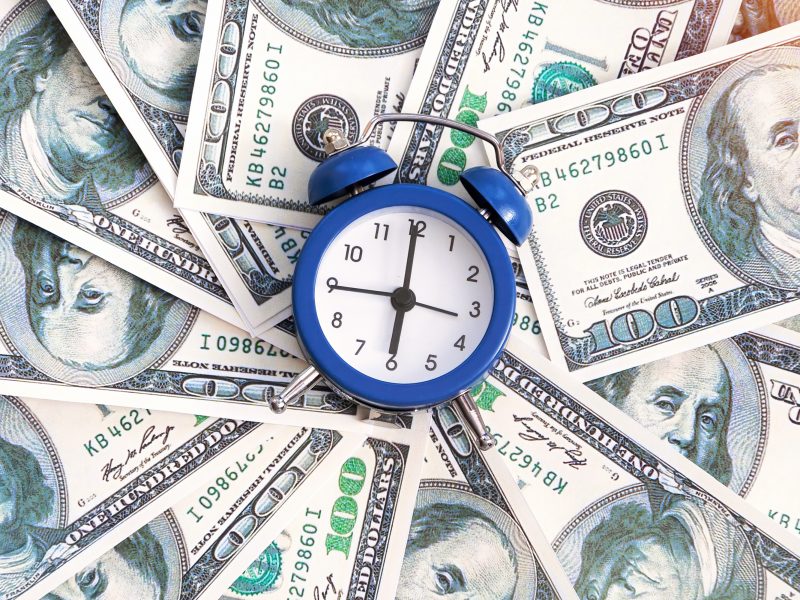 layer-money-with-clock-center-finance-idea