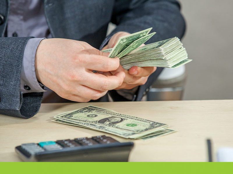 man counting money