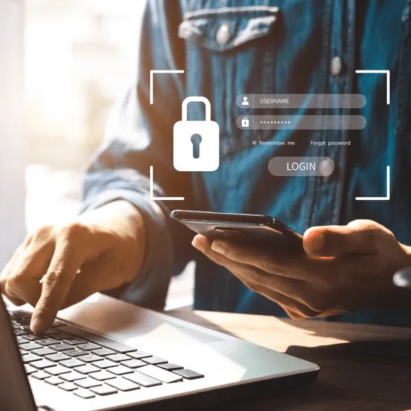 A graphic showing a shield protecting a computer from cyber attacks, symbolizing business protection